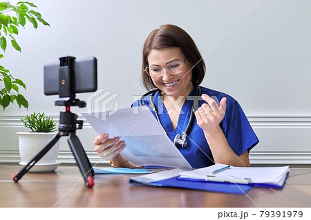 Online doctor consultation, female talking with patient using video call 79391979