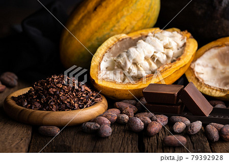 cocoa pods, beans and powder on wooden table, top view 79392928