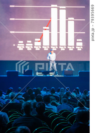 Audience listening to financial lecture 79395669