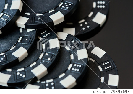 Close up on poker casino casino chips on dark background 79395693