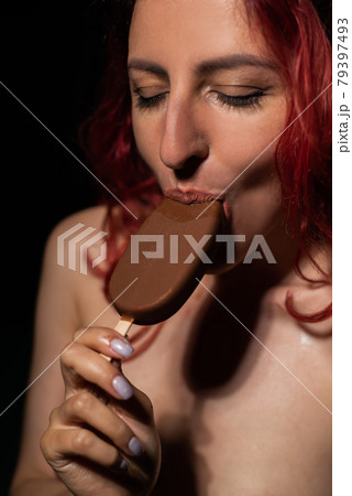 Seductive woman eats ice cream sexually 79397493
