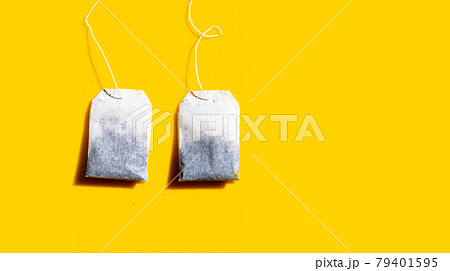 Tea bags on yellow background. 79401595