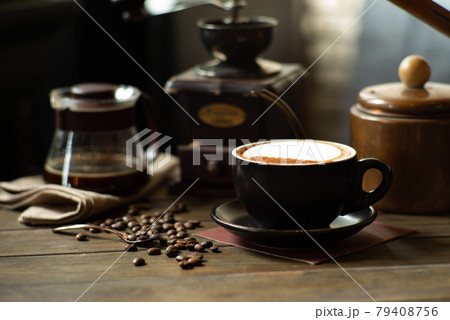 Coffee and tea on the table with selective focus on cappucino cup and beans Coffee and tea on the table with selective focus on cappucino cup and beans 79408756
