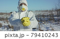 Virologist constricts plastic plate with inscription "Stop Plastic" 79410243