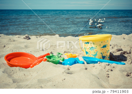 Children toys for relax or playing at beach. Summer, vacation time and child development Children toys for relax or playing at beach. Summer, vacation time and child development 79411903