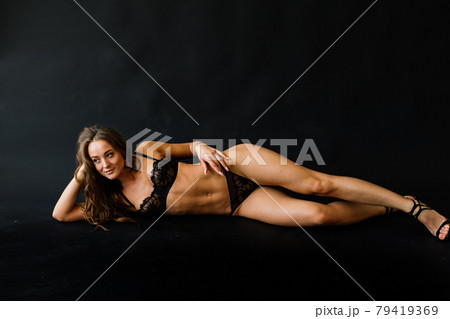 Beautiful and seductive woman wearing black lingerie Beautiful and seductive woman wearing black lingerie 79419369