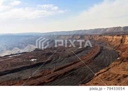 Railroad track in the iron ore quarry 79433054