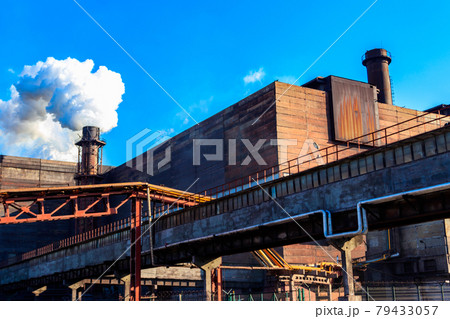 View of old factory with pipe with smoke. Air pollution, environmental damage View of old factory with pipe with smoke. Air pollution, environmental damage 79433057
