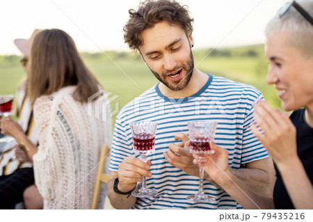 Two friends hanging out at picnic outdoors Two friends hanging out at picnic outdoors 79435216