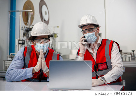 Quality control worker analyzing manufacturing machine in laboratory. Quality control worker analyzing manufacturing machine in laboratory. 79435272