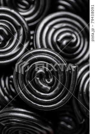 Spiral from liquorice candy. 79438091