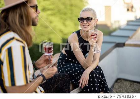 Two friends hanging out at picnic outdoors Two friends hanging out at picnic outdoors 79438267