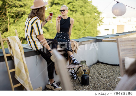 Two friends hanging out at picnic outdoors 79438296