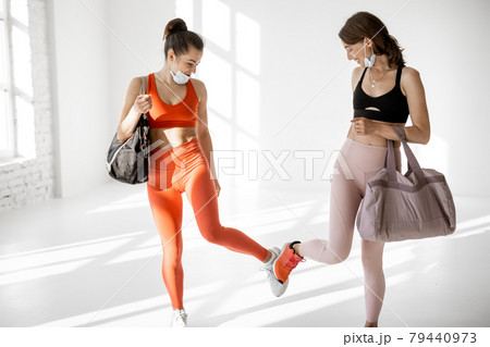 Sports women in face masks met in the gym Sports women in face masks met in the gym 79440973