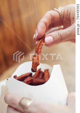 Carrot potatoes in a cardboard box. Instant vegetarian dish. Grilled vegetables. BBQ cooking concept for people who do not eat meat and do not like vegetables 79449563