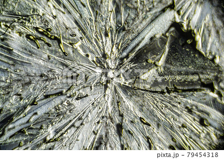Salt crystal macro close up under the light microscope, magnification of 100 times, microscope objective 10 79454318