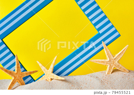 Picture frame with copy space and starfish on sand as a summer background Picture frame with copy space and starfish on sand as a summer background 79455521