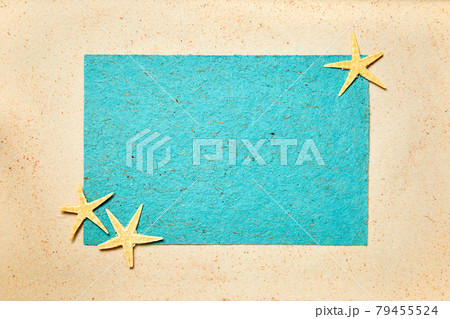 Summer background of sand decorated with starfish and blue copy space Summer background of sand decorated with starfish and blue copy space 79455524