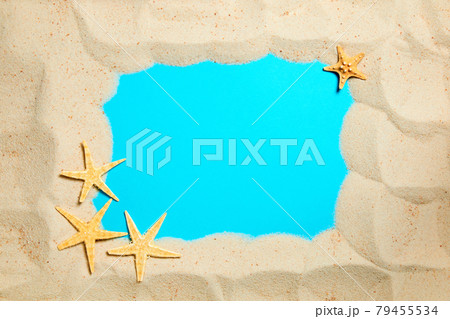 Summer background of sand decorated with starfish and blue copy space 79455534