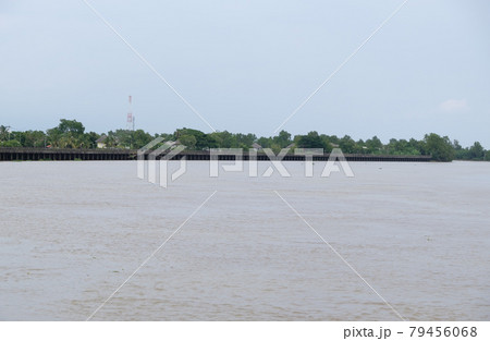 Long concrete embankment along the large river to protect the bank erosion. Long concrete embankment along the large river to protect the bank erosion. 79456068