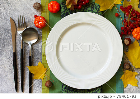 Autumn rustic table. Thanksgiving or autumn harvest table setting on stone or slate table. Top view of a flat lay. Free space for your text. 79461793