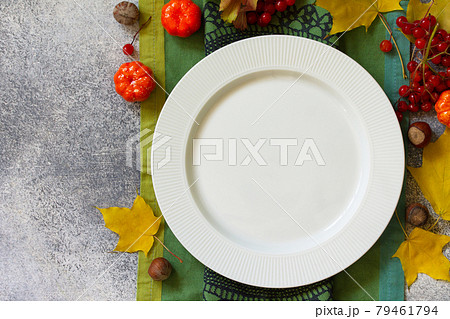 Autumn rustic table. Thanksgiving or autumn harvest table setting on stone or slate table. Top view of a flat lay. Free space for your text. 79461794