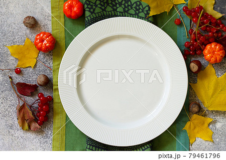 Autumn rustic table. Thanksgiving or autumn harvest table setting on stone or slate table. Top view of a flat lay. Free space for your text. 79461796