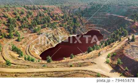 Acidic red lake in open pit of abandoned Kokkinopezoula copper mine in Mitsero, Cyprus 79465878