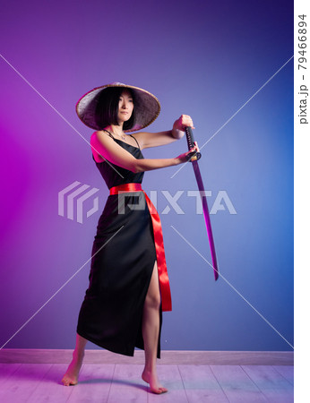 slender Asian woman an Asian hat with a katana in her hand image of a samurai slender Asian woman an Asian hat with a katana in her hand image of a samurai 79466894