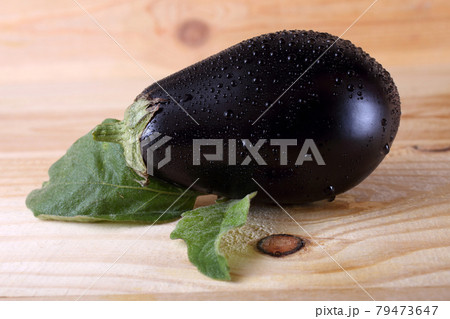 Aubergine on table Aubergine on table 79473647