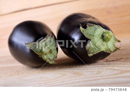 Aubergines on table Aubergines on table 79473648