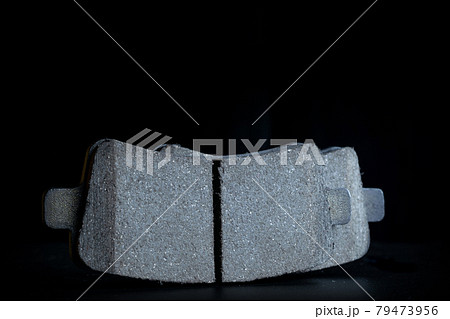 Vehicle parts. Auto motor mechanic spare or automotive piece on dark background. New metal car part. Repair and vehicle service with space for text. Vehicle parts. Auto motor mechanic spare or automotive piece on dark background. New metal car part. Repair and vehicle service with space for text. 79473956