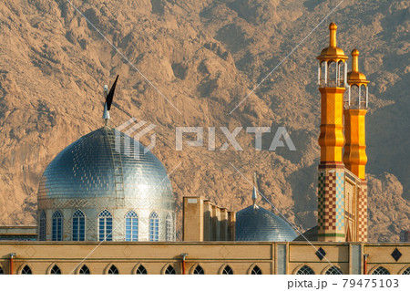 School for clerics in Kermanshah. The close up view on pair of minarets with the dome. Early morning, winter time. School for clerics in Kermanshah. The close up view on pair of minarets with the dome. Early morning, winter time. 79475103