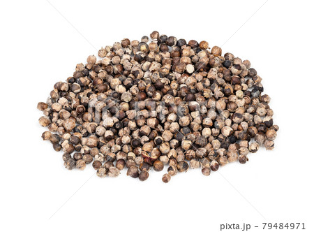 pile of monk's pepper (Vitex) closeup on white 79484971