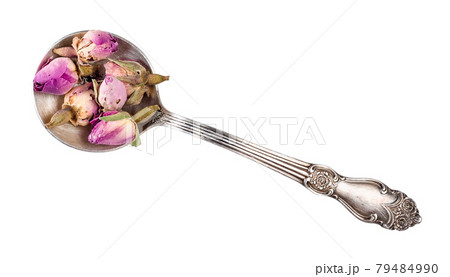 dried rose buds in silver spoon cutout 79484990