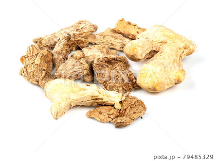 several dried ginger roots closeup on white several dried ginger roots closeup on white 79485329