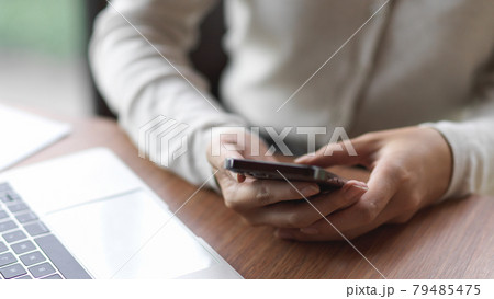 Businesswoman using smartphone 79485475