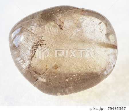 tumbled Rutilated quartz stone on white tumbled Rutilated quartz stone on white 79485567