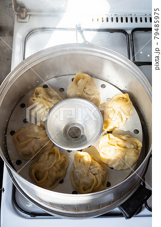 homemade manti dumpling are cooking in steamer 79485975