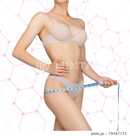 The girl taking measurements of her body, white background. 79487733