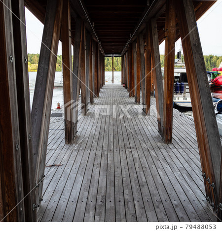 inside wooden pier on lake on sunny evening 79488053