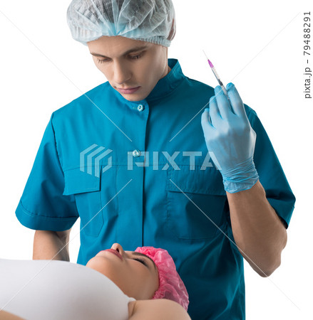 Surgeon giving lip beauty injections to a girl 79488291