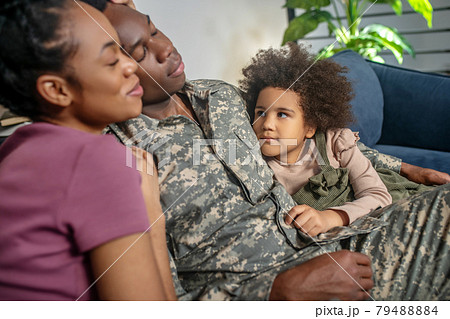 Happy man and woman with closed eyes and daughter Happy man and woman with closed eyes and daughter 79488884