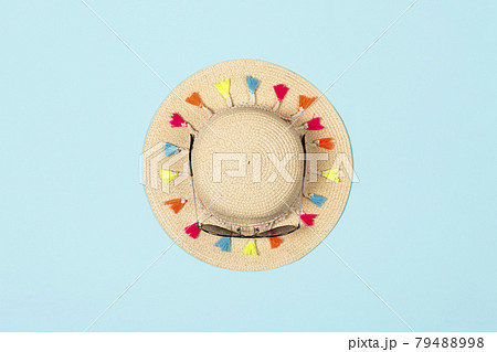 Minimalistic summer banner. Summer straw hat with sunglasses on pastel blue background 79488998
