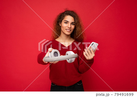 Photo of beautiful positive smiling young woman wearing stylish casual outfit isolated on colorful Photo of beautiful positive smiling young woman wearing stylish casual outfit isolated on colorful 79491699
