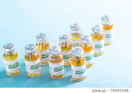 Vials with a new modern medicine for coronavirus on a blue background in the laboratory. Copy space for text, SARS-Cov-2 Vials with a new modern medicine for coronavirus on a blue background in the laboratory. Copy space for text, SARS-Cov-2 79495396