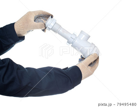 Plumber holding a drain siphon on a white background, isolate, close-up. Equipment Plumber holding a drain siphon on a white background, isolate, close-up. Equipment 79495480