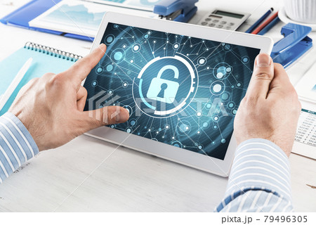 Businessman with a computer tablet at a work desk 79496305