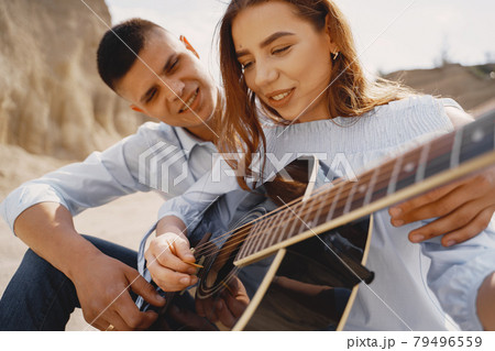 Young couple in love in sand career Young couple in love in sand career 79496559