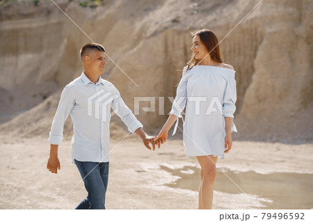 Young couple in love in sand career Young couple in love in sand career 79496592